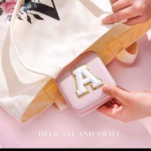 Small jewelry box with zipper. I have it in letter A and M.